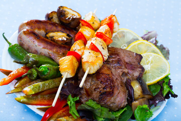 Meshana skara - dish of Bulgarian cuisine. Mixed grill consist of various types of grilled meat and sausages with vegetables