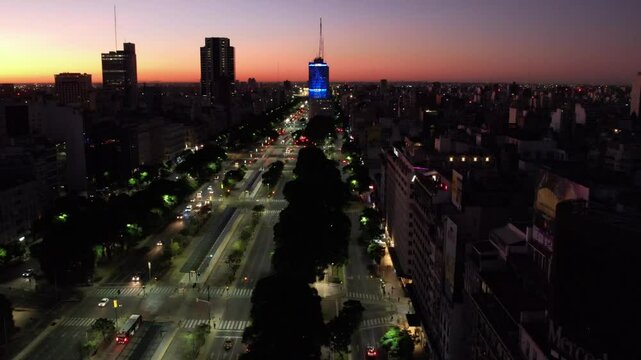 aerial image of 9 de julio avenue in buenos aires, with the building of the ministry of social development and Evita, at dawn.