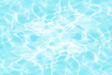 Blue water with ripples on the surface. Defocus blurred transparent blue colored clear calm water surface texture with splashes and bubbles. Water waves with shining pattern texture background.