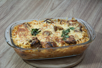 A delicious plate of spaghetti with juicy meatballs in a rich tomato sauce, garnished with fresh basil. Perfectly styled for a mouthwatering food shot.