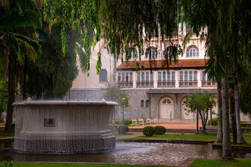 Illuminated fountain in front of the old casino building in Poços de Caldas, MG, showcasing a...