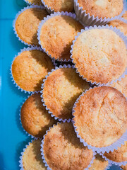 Stacks of sweet muffins and cupcakes with delicious sweet flavors.