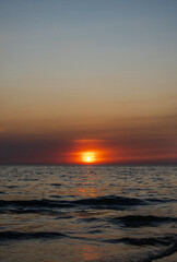 Sunset sea vertical view landscape horizon beautiful summer season shore nobody wind soft wave cool holiday look calm big sunset sky twilight evening day time nature tropical coast ocean water travel