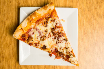 Slice of meat lovers’ pizza