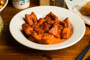 Boneless chicken pieces in a bowl