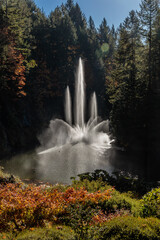 Fototapeta premium A waterfall is spraying water into a lake