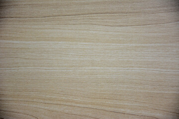 A close-up shot of a wooden texture background, showcasing a warm, natural wood grain pattern with subtle light and dark variations. Ideal for design, product display, or rustic themes.
