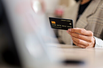 Businesswoman Securely Enters Payment Details Online With Credit Card And Computer, Showcasing The Convenience of E Commerce in Today's Digital Age
