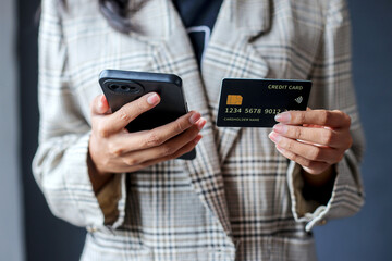 Businesswoman Showing Credit Card For Payment Online With Credit Card And Smartphone
