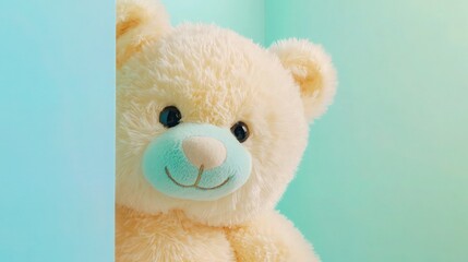 A soft pastel-yellow teddy bear, peeking playfully from behind a light blue panel on the left side. 