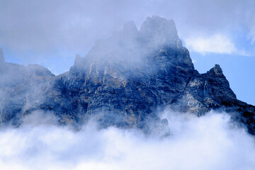 Fog and clouds on  rugged mountain peak