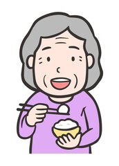 ご飯を食べる高齢者の女性