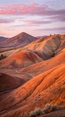 Fototapeta premium rolling volcanic hills glowing under twilight