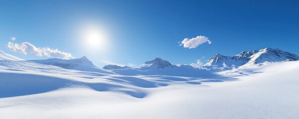 Obraz premium A serene winter landscape featuring snow-covered mountains and a clear blue sky.