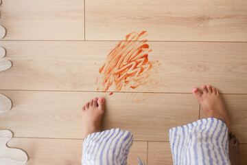 The Joyful and Colorful Mess Created During a Childs Playtime on a Wooden Floor