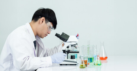 Man asian student education learning scientist wearing doctor gown in lab looking hand at chemist....