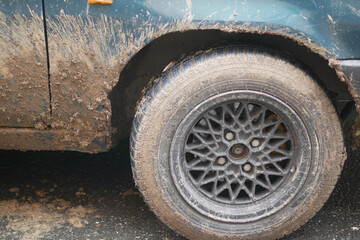 CloseUp Capture of a MudCovered Tire on a Vintage Classic Cars Exterior Surface