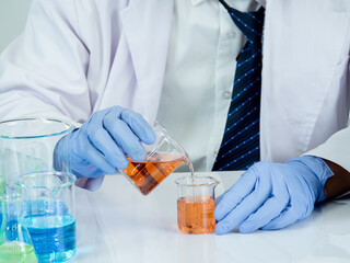 Close-up hand man asian student education learning scientist lab look hand holding chemist. caused...