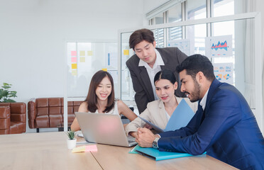 Business team woman and man asian group meeting sitting on desk looking talk think creative idea...