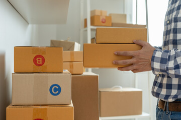 Warehouse worker pick box goods in inventory and check stock product. Transport logistic business ship delivery to customer. stock card, bill of material, inspection, storehouse, storage, factory