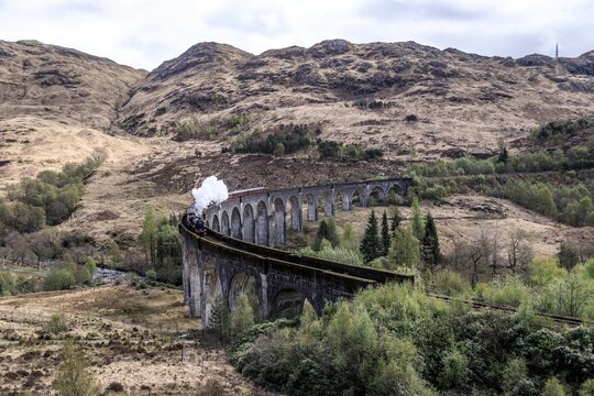 Majestic Steam Train Chugging Across the Glenfinnan Viaduct, Glencore, Scotland