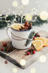 mulled wine with orange slices, cranberry and cinnamon sticks