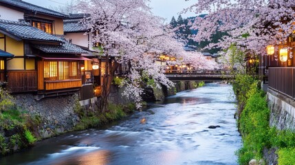 Obraz premium Charming Riverside Village with Blooming Trees