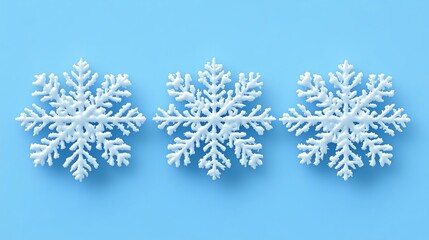Elegant Snowflakes on Blue Background for Winter Aesthetics