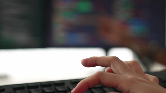 Slow motion closeup hand, back end software developer engineer for computer programming working together on debugging writing computing code, solving complex algorithms display on monitor. Burgeoning