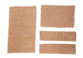 Fototapeta premium Pieces of burlap fabric on white background