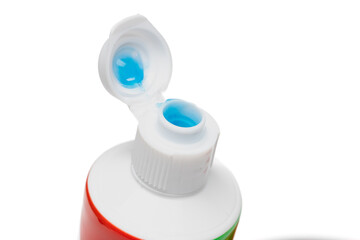 close up view of toothpaste tube cap. flip top type. on white background.