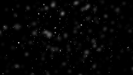 Winter freeze motion of white snow coming down, isolated on black background. Snowfall texture overlays.