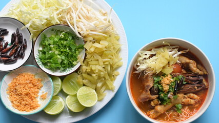 rice vermicelli with northern thai curry sauce on blue background