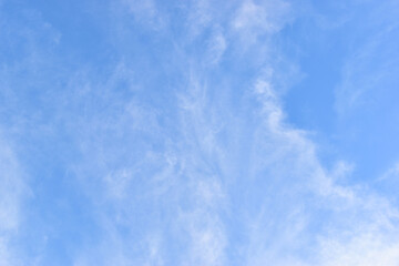 beautiful blue sky and white fluffy group of clouds with sunrise in the morning, natural background