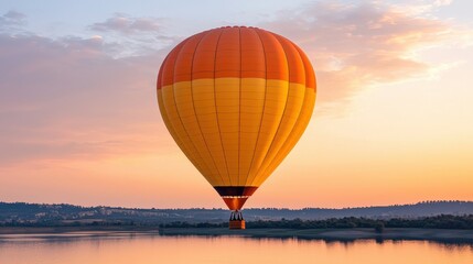 Fototapeta premium A vibrant hot air balloon floats serenely over a calm body of water during a beautiful sunset, creating a picturesque and tranquil scene.
