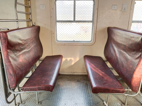 Indian passenger memu train interior. New general coach. Empty cabin of a modern passenger train. Empty blue seats inside train cabin, corridor view, no people.
