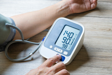 Man check blood pressure monitor and heart rate monitor with digital pressure gauge. Health care...