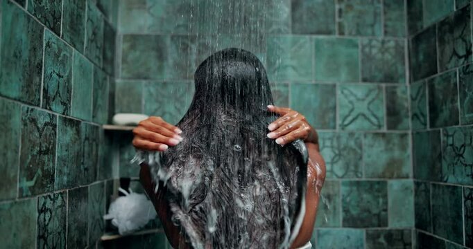 Grooming, shower and hair care with woman in bathroom for hygiene, beauty and repair treatment. Volume, cleaning and shampoo with back of person and washing at home for soap, hydration and cosmetics