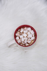 A Cozy Christmas Mug Filled with Creamy Hot Cocoa and Tasty Marshmallows to Enjoy