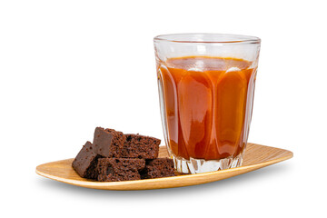 Sweet chocolate crispy brownie cube and a glass of tomato juice in wooden tray isolated on white background with clipping path.