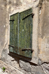 old wooden window on old wall.