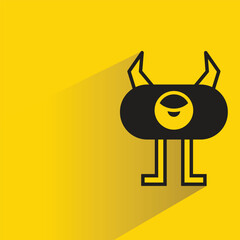 cute monster character with drop shadow on yellow background