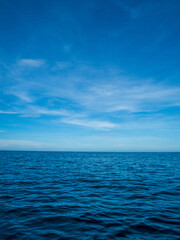 Landscape photography beautiful summer season vertical horizon tropical shore open sea cloud clean blue sky background calm nature ocean wave water nobody travel at Koh Muk Trang Thailand sun day time