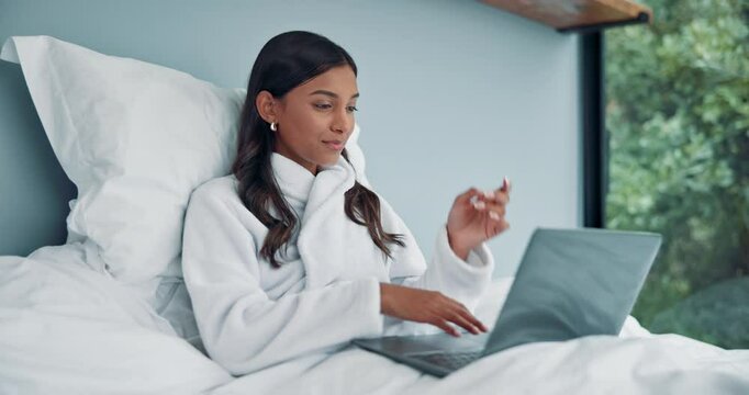 Thinking, bed and woman typing on laptop in home for online article, inspiration or writing a publication. Remote work, freelancer and story plot in robe for proofreading or email response in bedroom
