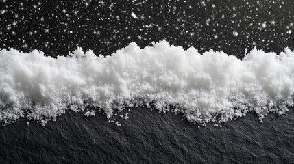 A serene Christmas scene with snow on a dark surface creates a striking, tranquil ambiance.