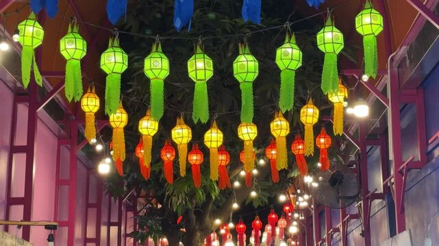 Thailand loi krathong yi peng festival hanging colorful paper lanterns over entrance	