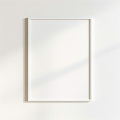 white picture frame mockup on a white wall with sunlight  for interior design and home decor projects