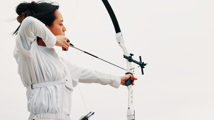 Woman, archery and aim at sky as sport for shooting practice and training as athlete in Japan....