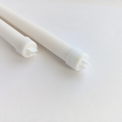 Plastic perches for birds in a cage. Products for keeping parrots. White perches for a cage.