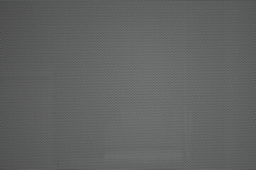 gray background, in the photo is a perforated sheet of iron